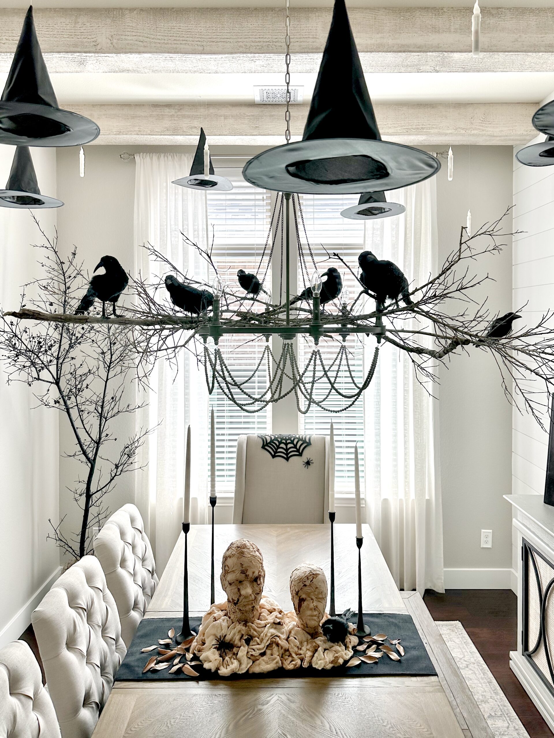 Spooky Halloween Tablescape with Mummy Decor and Crow Accents